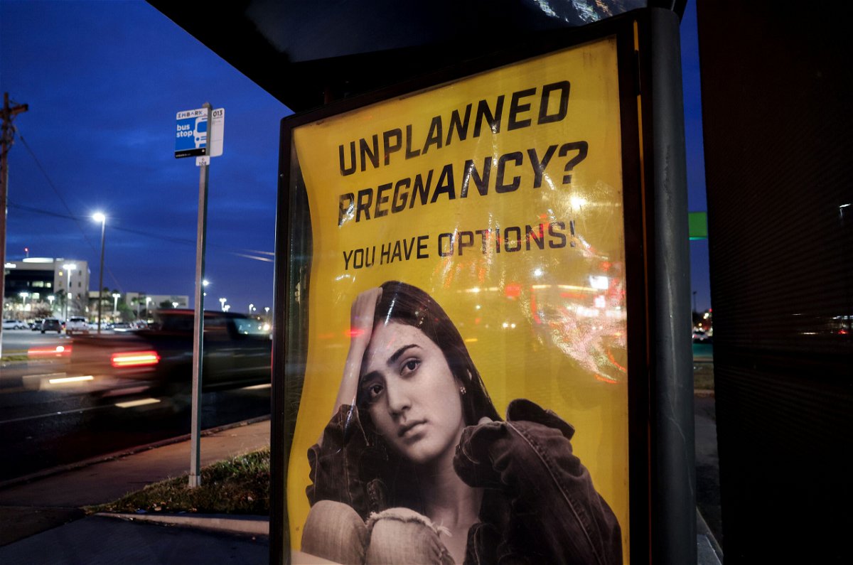 <i>Evelyn Hockstein/Reuters</i><br/>A billboard advertising adoption services targets pregnant women at a bus stop in Oklahoma City