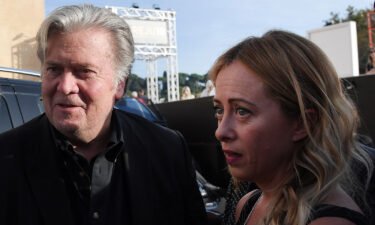 Former Trump White House chief strategist Steve Bannon (left) arrives with Giorgia Meloni to attend a congress of the Brothers of Italy party in Rome in September of 2018.