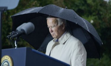 President Joe Biden stands during a moment of silence during a ceremony at the Pentagon on September 11