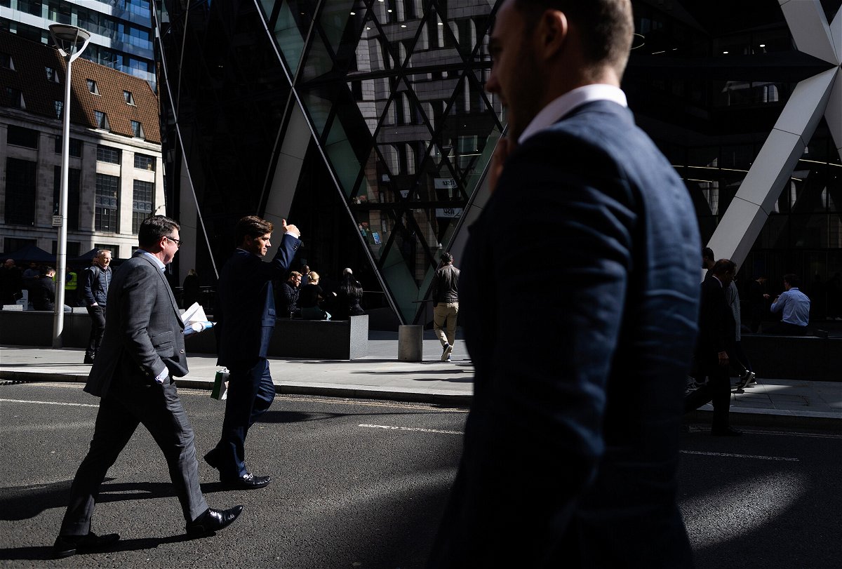 <i>Chris Ratcliffe/Bloomberg/Getty Images</i><br/>City workers are seen walking in the City of London