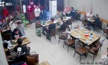 Video footage shows a man assaulting a woman at a restaurant in the Chinese city of Tangshan.