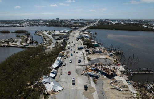 An aerial picture taken on September 29 shows washed up boats on a street in the aftermath of Hurricane Ian in Fort Myers