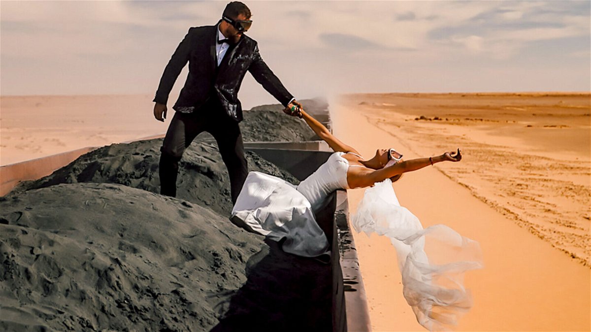 <i>Antonio Filipovic/Iluminol Digital</i><br/>Croatian newlyweds Kristijan (left) and Andrea Ilicic opted for a freight train carrying wagons of dirty iron ore across northwest Africa for their honeymoon destination.