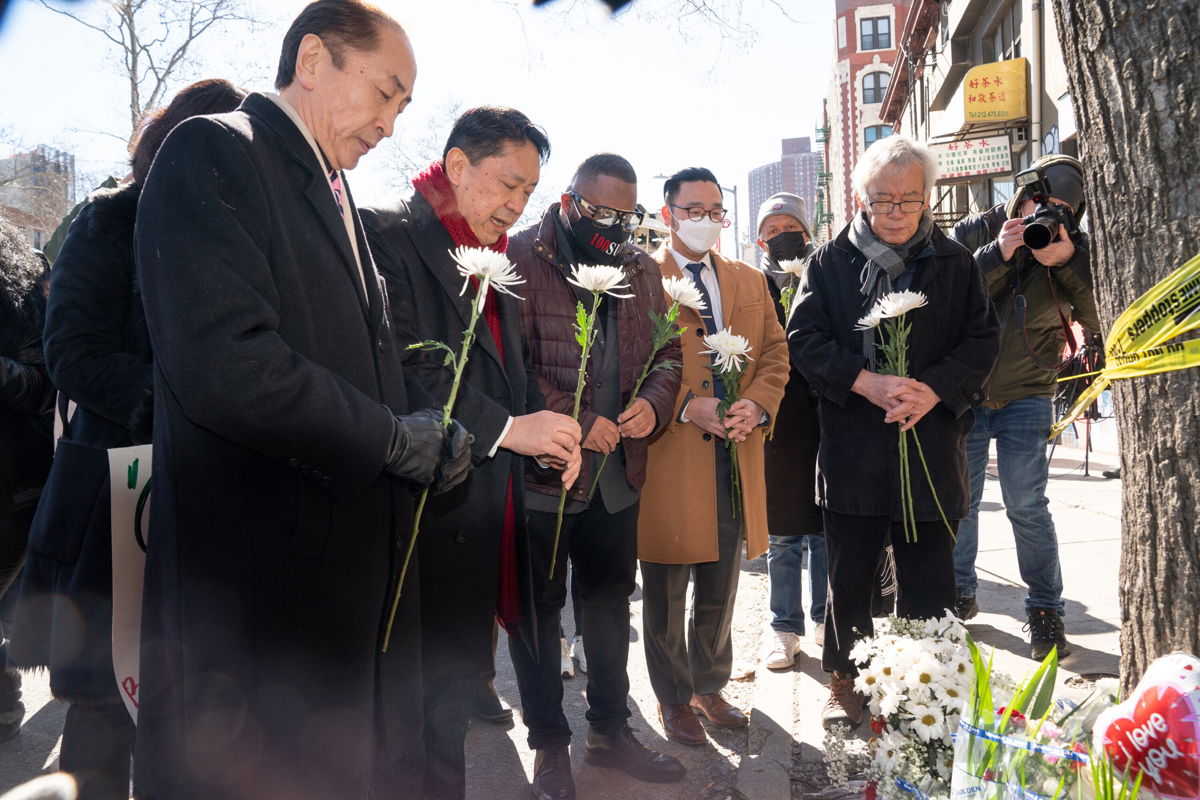 <i>Barry Williams/New York Daily News/TNS/Getty Images</i><br/>Asian American community leaders place flowers on a memorial for murder victim Christina Yuna Lee after an anti-Asian hate rally in New York City on February 15.