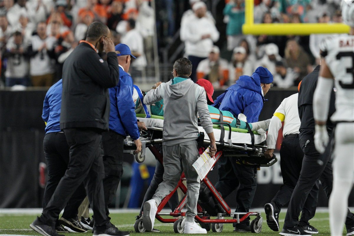 <i>Jeff Dean/AP</i><br/>Miami Dolphins quarterback Tua Tagovailoa is taken off the field on a stretcher during the first half of an NFL football game against the Cincinnati Bengals