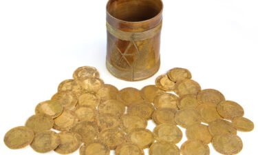 The discovery of more than 260 gold coins dating back to the 17th and 18th centuries is "one of the largest on archaeological record from Britain