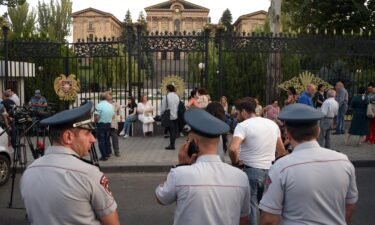 Armenian opposition supporters and relatives of servicemen wounded in border clashes between Armenia and Azerbaijan gather in front of the parliament to call for the Armenian prime minister's resignation