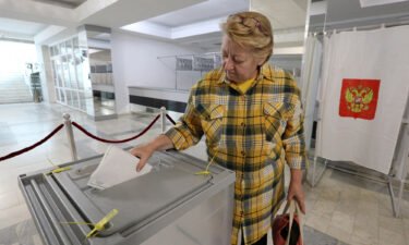 A woman casts her ballot in Sevastopol