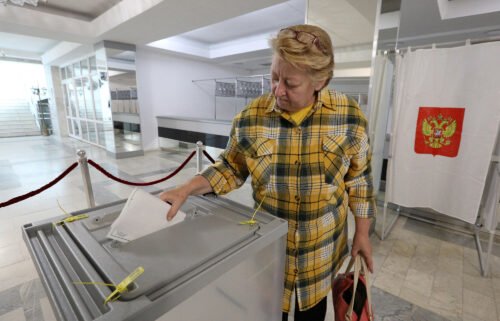 A woman casts her ballot in Sevastopol