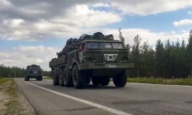 Russian military vehicles drive to the Kharkiv direction