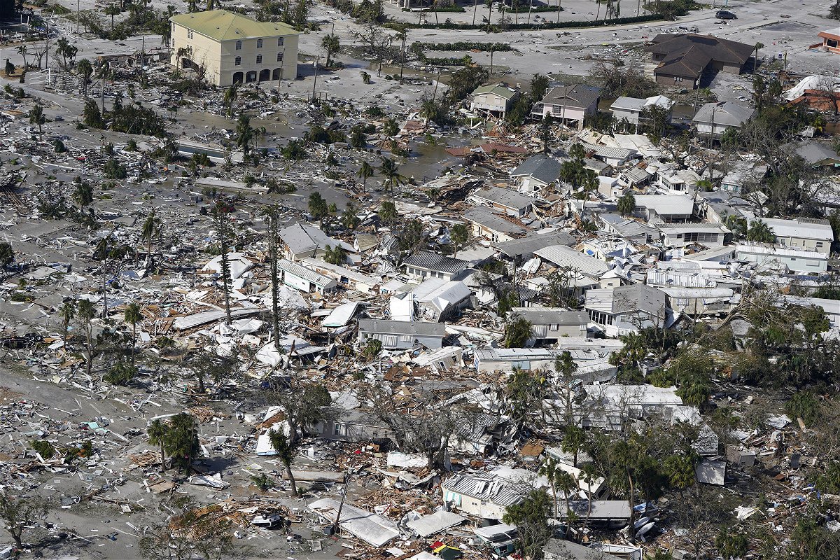 <i>Wilfredo Lee/AP</i><br/>Damaged homes and debris are shown in the aftermath of Hurricane Ian on September 29 in Fort Myers