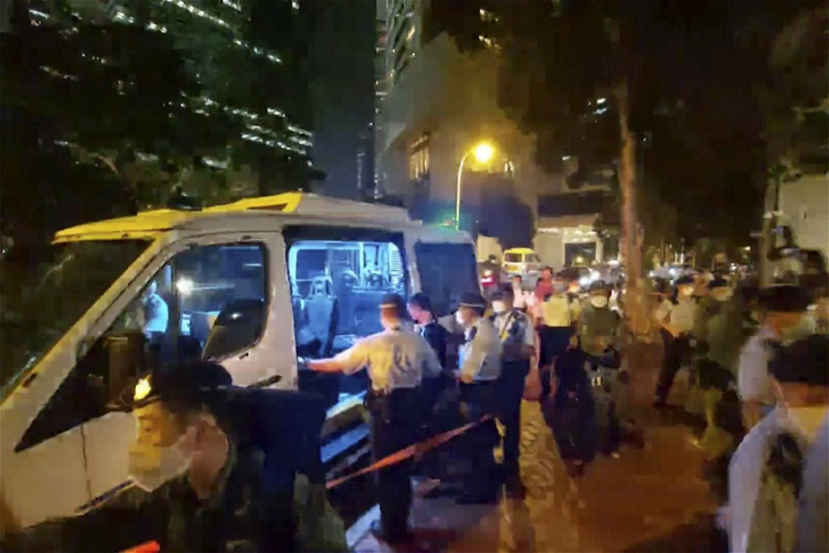 <i>AP</i><br/>Police arrest a man who played songs on a harmonica outside the British consulate in Hong Kong on September 19.