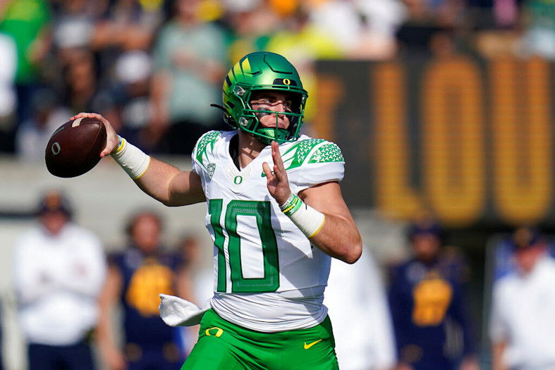 Oregon quarterback Bo Nix throws a pass against California during the first half of an NCAA college football game in Berkeley, Calif., Saturday