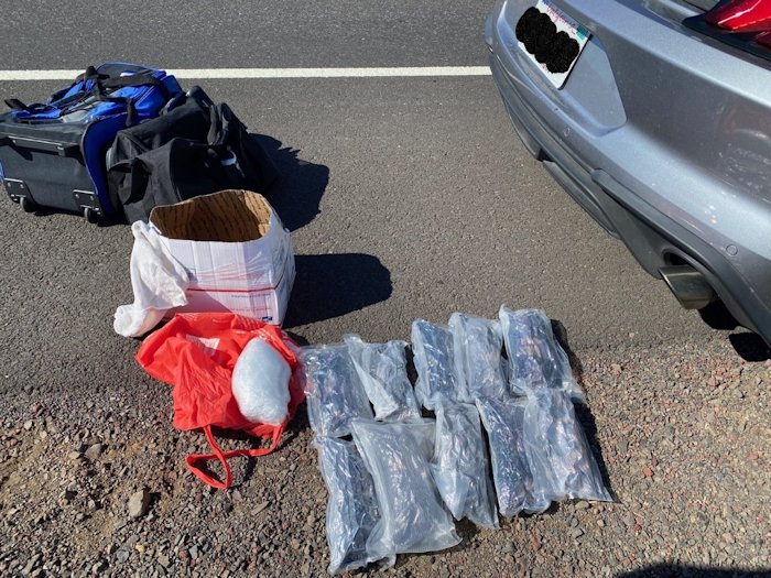 An OSP traffic stop for speeding led to driver's arrest after 14 bundles of suspected heroin were found in car's trunk