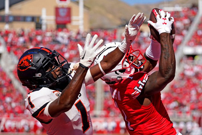 Utah cornerback Clark Phillips III, right, intercepts the ball from Oregon State wide receiver Tyjon Lindsey (1) during the second half of Saturday's contest 