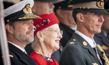 Queen Margrethe is flanked by her sons Crown Prince Frederik (L) and Prince Joachim (R) as she attends festivities in Korsoer