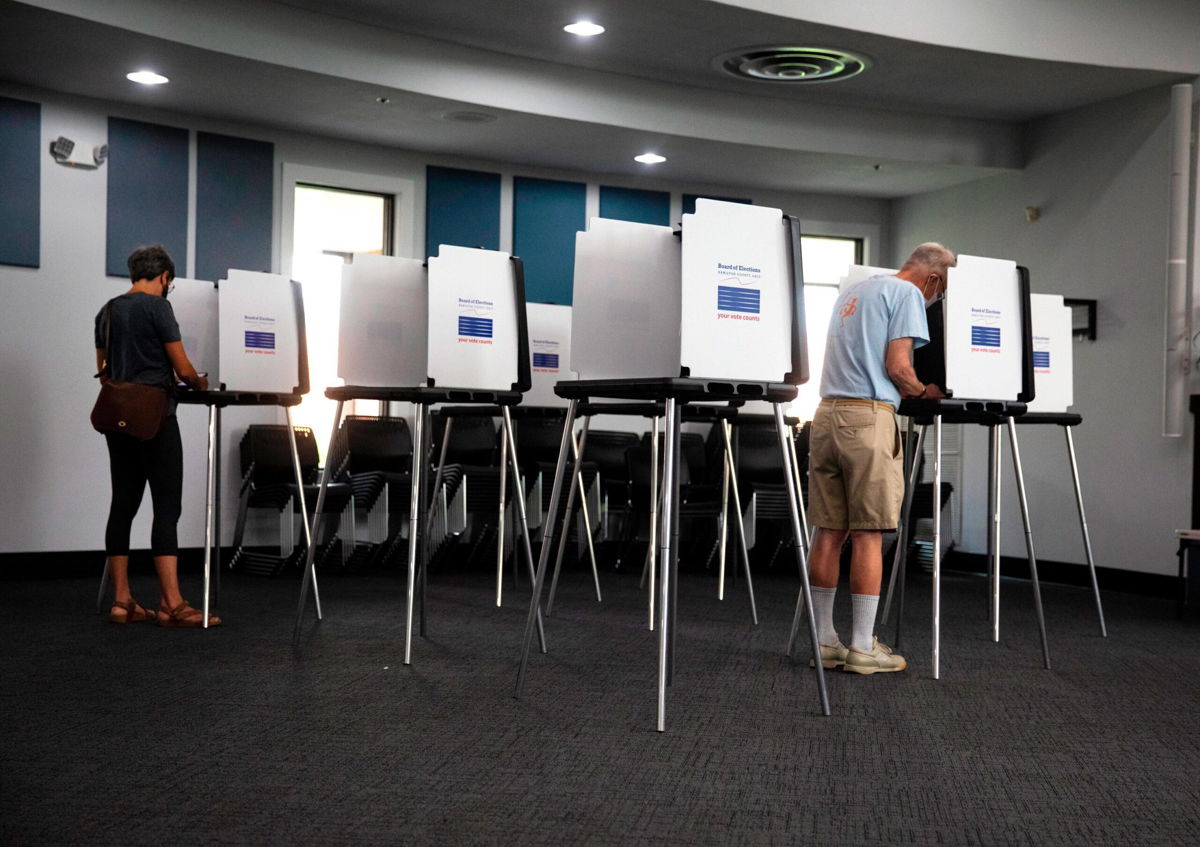 <i>Liz Dufour/The Cincinnati Enquirer/AP</i><br/>Voters cast their vote in the Blue Ash