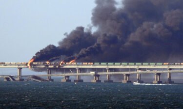 Black smoke billows from a fire on the Kerch bridge that links Crimea to Russia