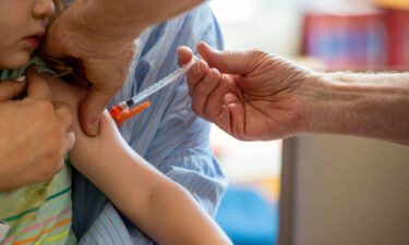FDA authorizes updated Covid-19 booster shots for children as young as 5. A young child here receives the Covid-19 vaccine in Needham