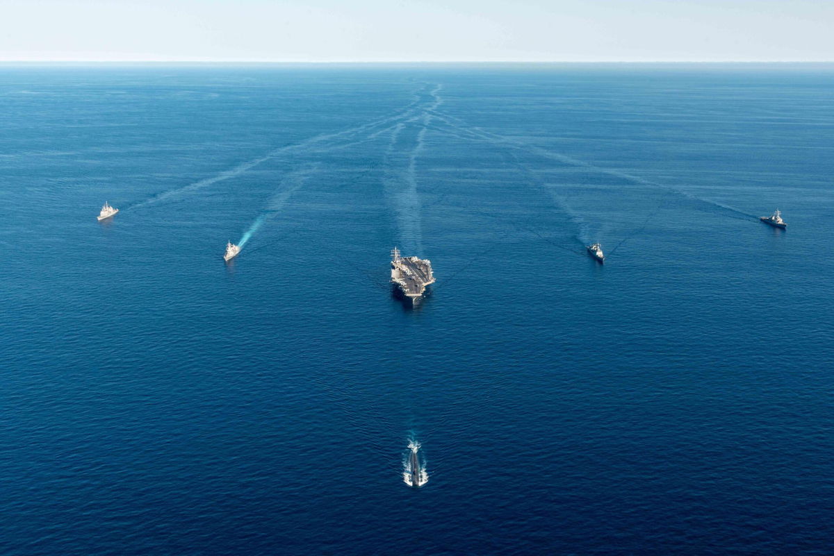 <i>Handout/Getty Images</i><br/>A US aircraft carrier and submarine