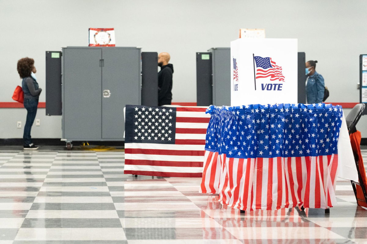 <i>Megan Varner/Getty Images</i><br/>Voters turn out to cast their ballots as early voting begins on October 17
