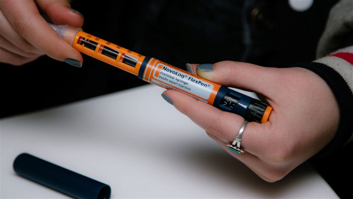 <i>Alex Flynn/Bloomberg via Getty Images</i><br/>A person fastens a Becton Dickinson And Co. (BD) needle on a Novo Nordisk Inc. NovoLog brand insulin pen in New York in April 2019. A new study found that 1.3 million Americans with diabetes rationed insulin in the past year.