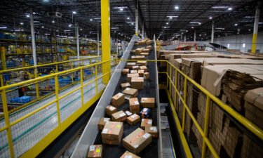 Packages move along a conveyor at an Amazon fulfillment center on Cyber Monday in Robbinsville