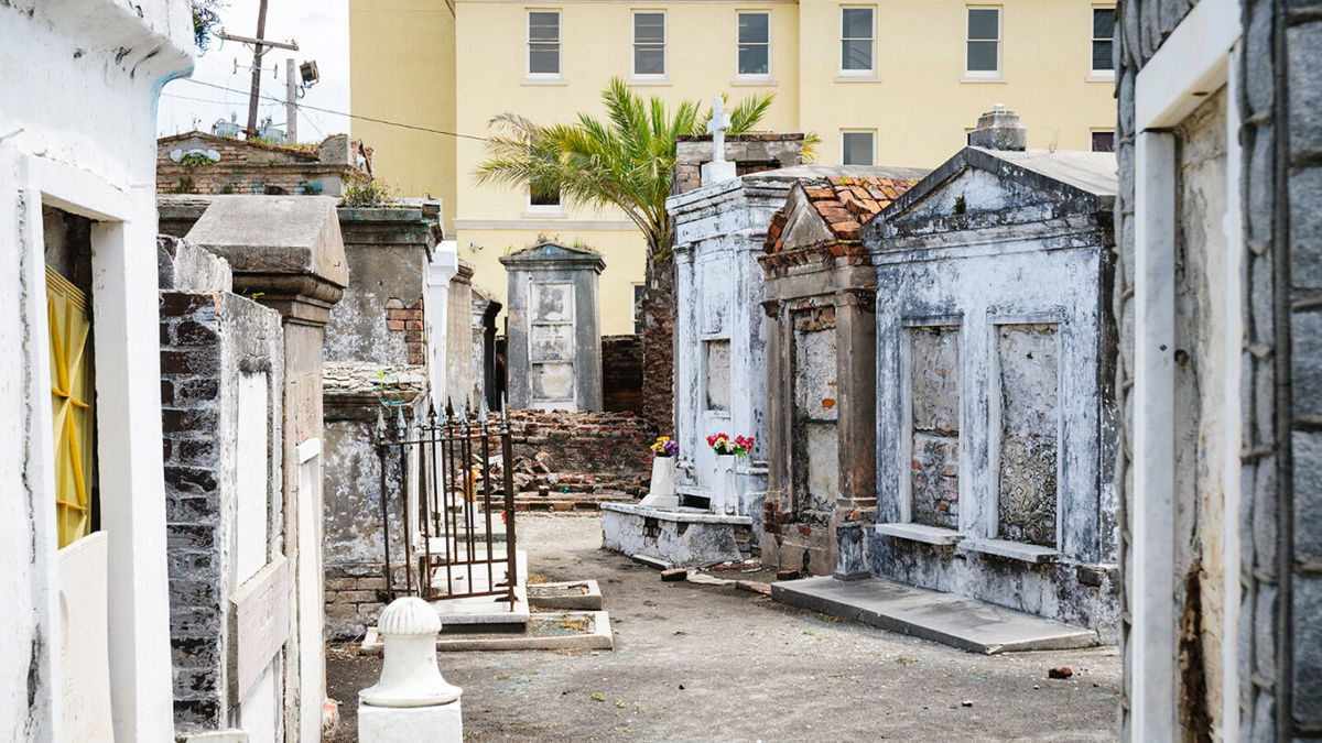 <i>zrfphoto/Getty Images</i><br/>Saint Louis Cemetery contains many above-ground graves and elaborate memorials to those buried there.