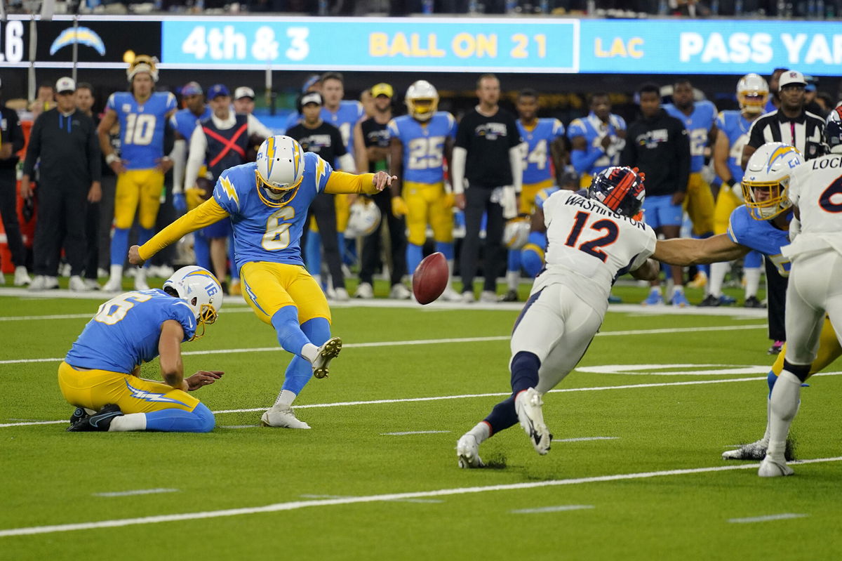 <i>Mark J. Terrill/AP</i><br/>Chargers kicker Dustin Hopkins kicks the winning field goal against the Denver Broncos in overtime.