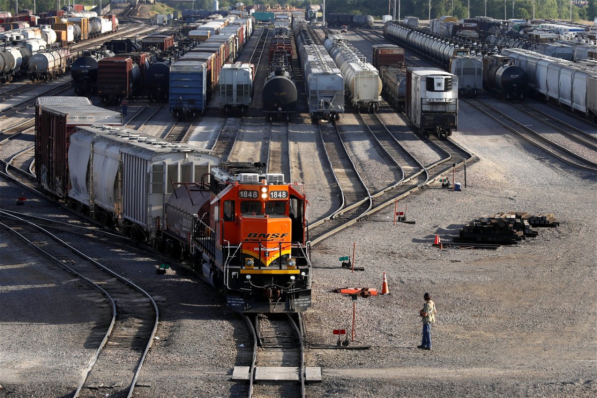 <i>Shafkat Anowar/AP</i><br/>The Biden administration issues new cybersecurity requirements for rail operators. A rail terminal worker here monitors the departure of a freight train