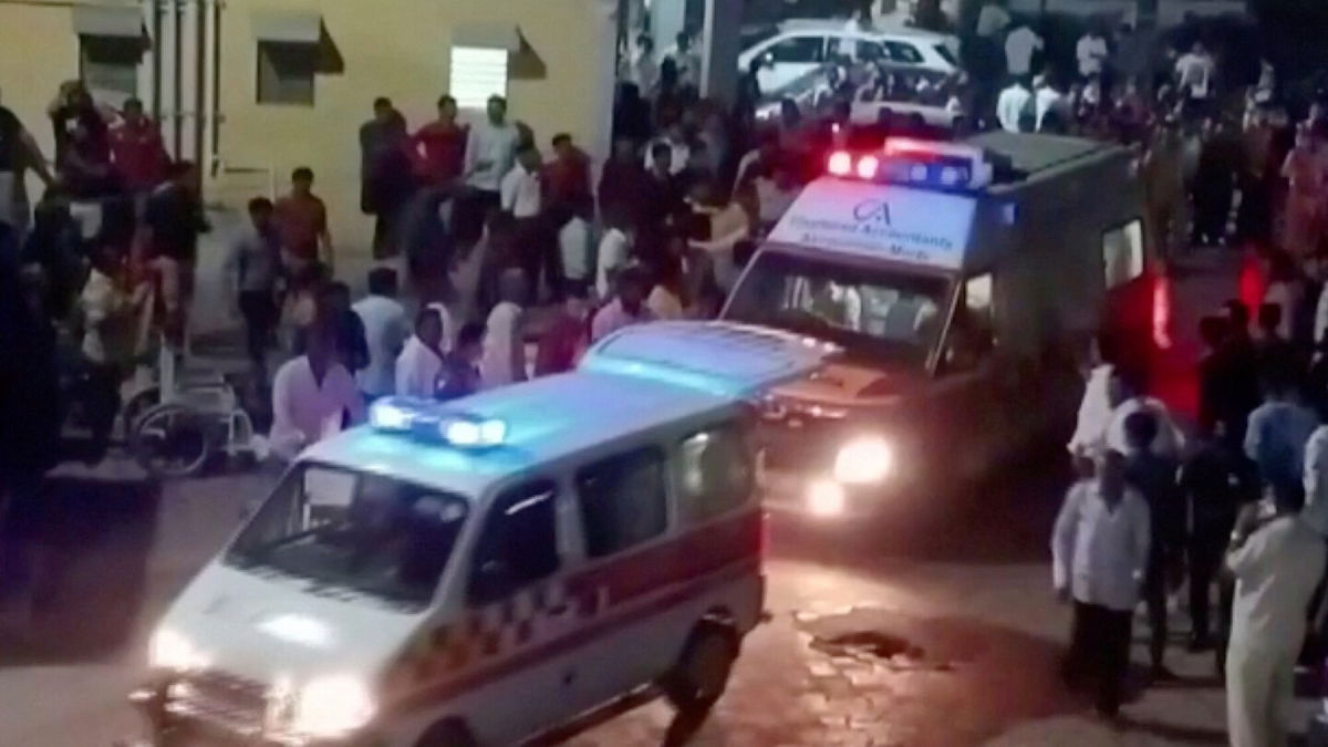 <i>ANI/Reuters</i><br/>Ambulances arrive at a hospital following the collapse of the suspension bridge in Morbi. At least 60 people were killed in India on October 30 when a bridge collapsed in the western state of Gujarat.