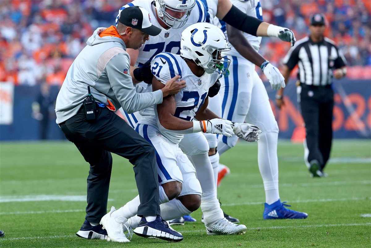 <i>Justin Tafoya/Getty Images</i><br/>Indianapolis Colts running back Nyheim Hines is helped to his feet after being hit during a game against the Denver Broncos at Empower Field At Mile High on October 6 in Denver