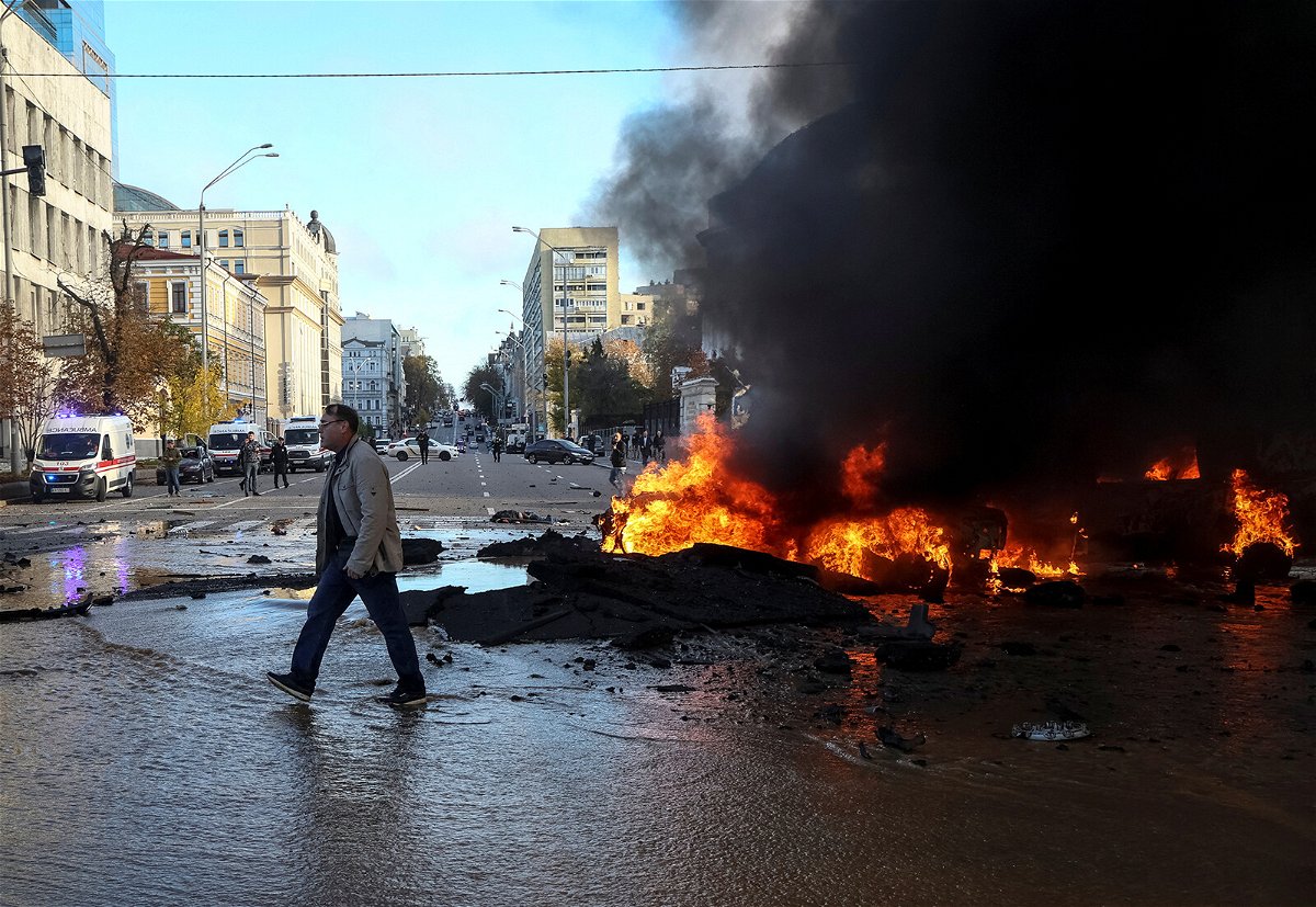 <i>Gleb Garanich/Reuters</i><br/>Cars burn after a Russian military strike in Kyiv