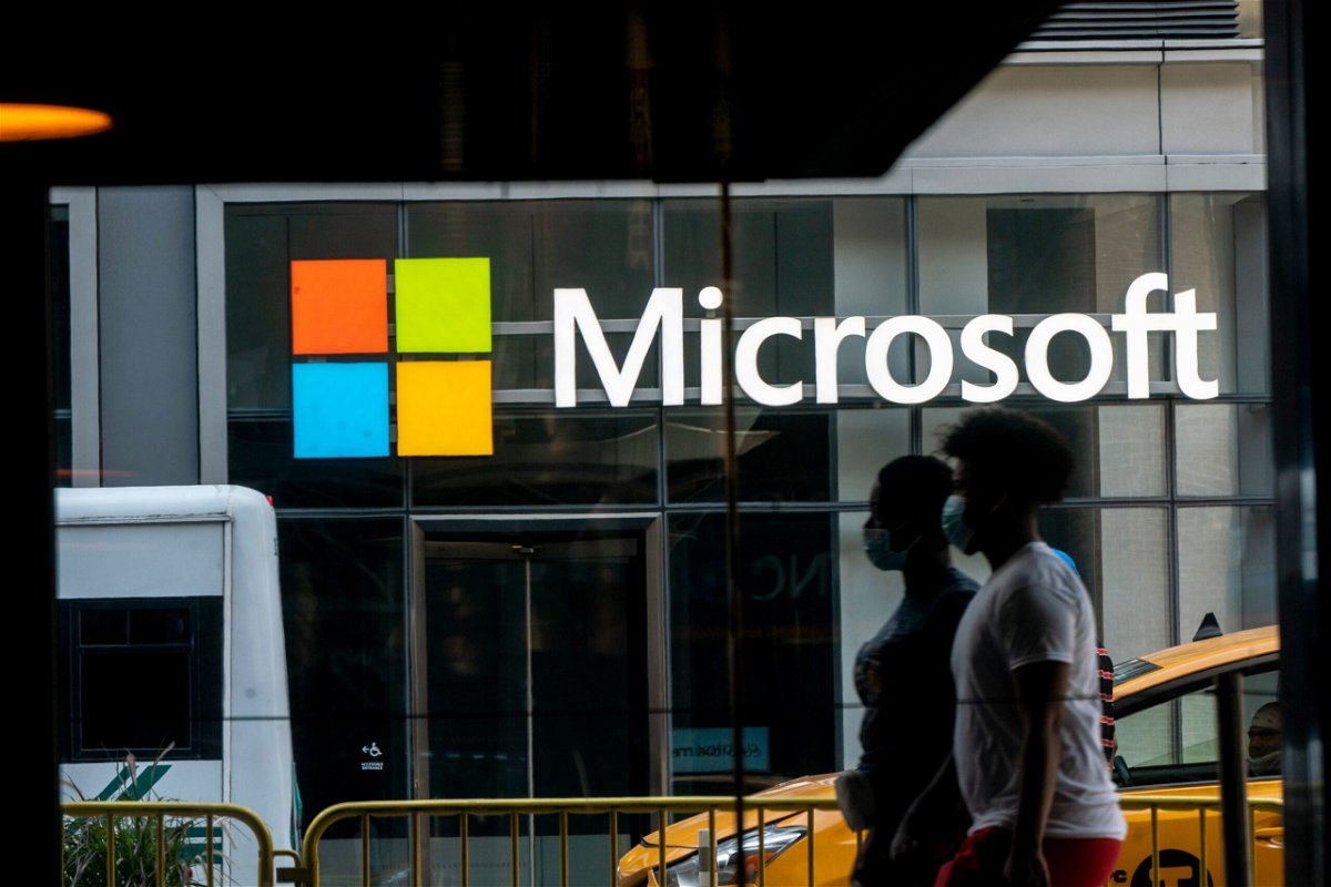 <i>Jeenah Moon/Bloomberg/Getty Images</i><br/>Pedestrians walk past a Microsoft Technology Center in New York in July 2020. Microsoft posted a double-digit profit decline in the three-month period ending in September.