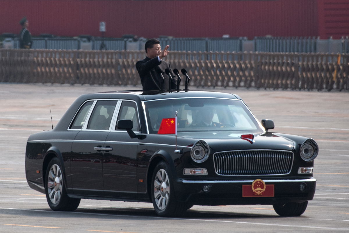 <i>Kevin Frayer/Getty Images</i><br/>Chinese President Xi Jinping waves as he drives after inspecting the troops during a parade to celebrate the 70th Anniversary of the founding of the People's Republic of China at Tiananmen Square in 1949