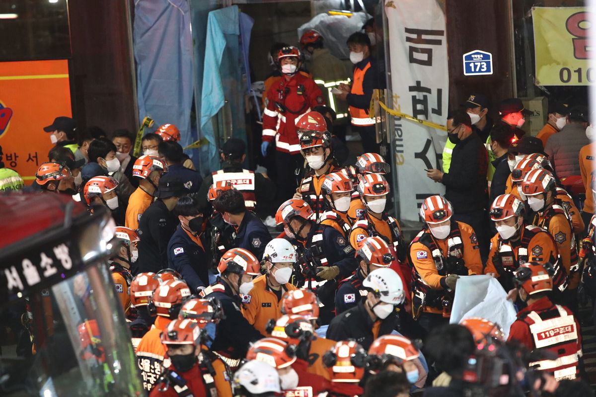 <i>Chung Sung-Jun/Getty Images</i><br/>Emergency services treat injured people in Seoul on October 30.