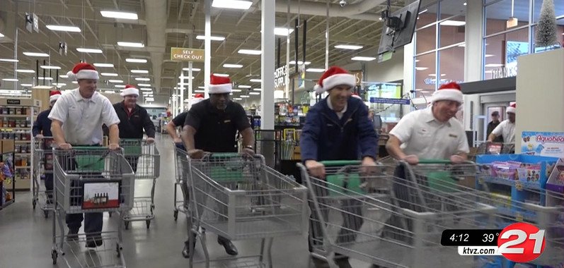 Les Schwab Tires managers get a fun Fred Meyer toy shopping spree for their Toy Drive with KTVZ
