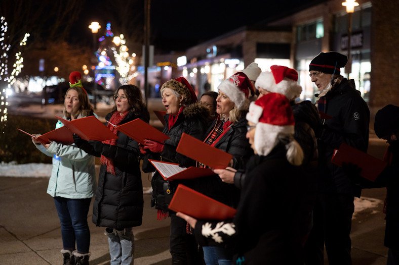 Carolers sing at SantaLand in Bend's Old Mill District