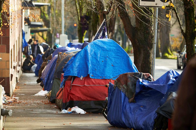 Tents line the sidewalk on SW Clay St in Portland, Ore., on Dec. 9, 2020