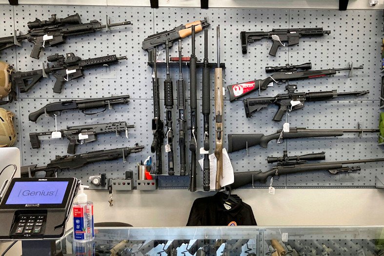 Firearms are displayed at a gun shop in Salem, Ore., on Feb. 19, 2021