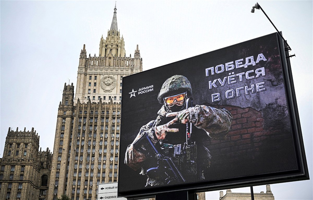 <i>Alexander Nemenov/AFP/Getty Images</i><br/>The Russian Foreign Ministry building is seen behind an advertising billboard showing the letter 
