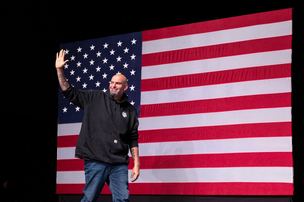 <i>Angela Weiss/AFP/Getty Images</i><br/>John Fetterman waves as he arrives onstage at a watch party during the midterm elections in Pittsburgh