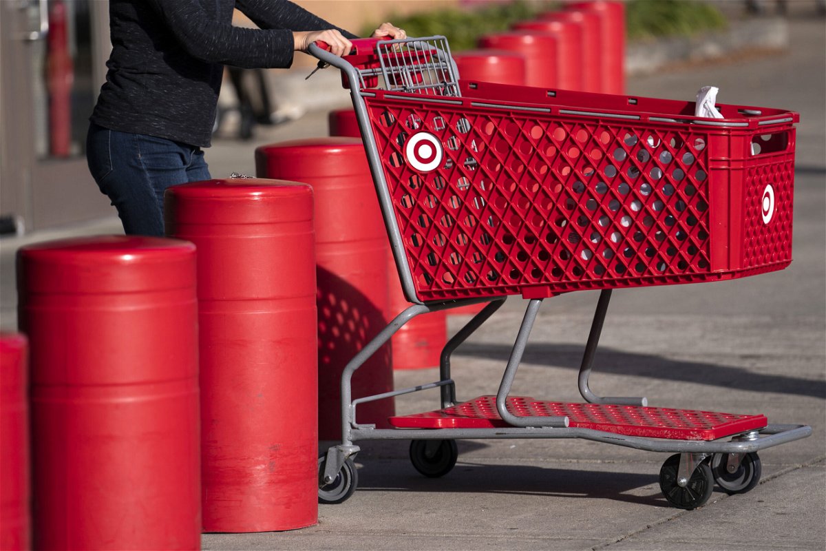 <i>Sarah Silbiger/Bloomberg/Getty Images</i><br/>A customer pushes a shopping cart outside a Target store in Hyattsville