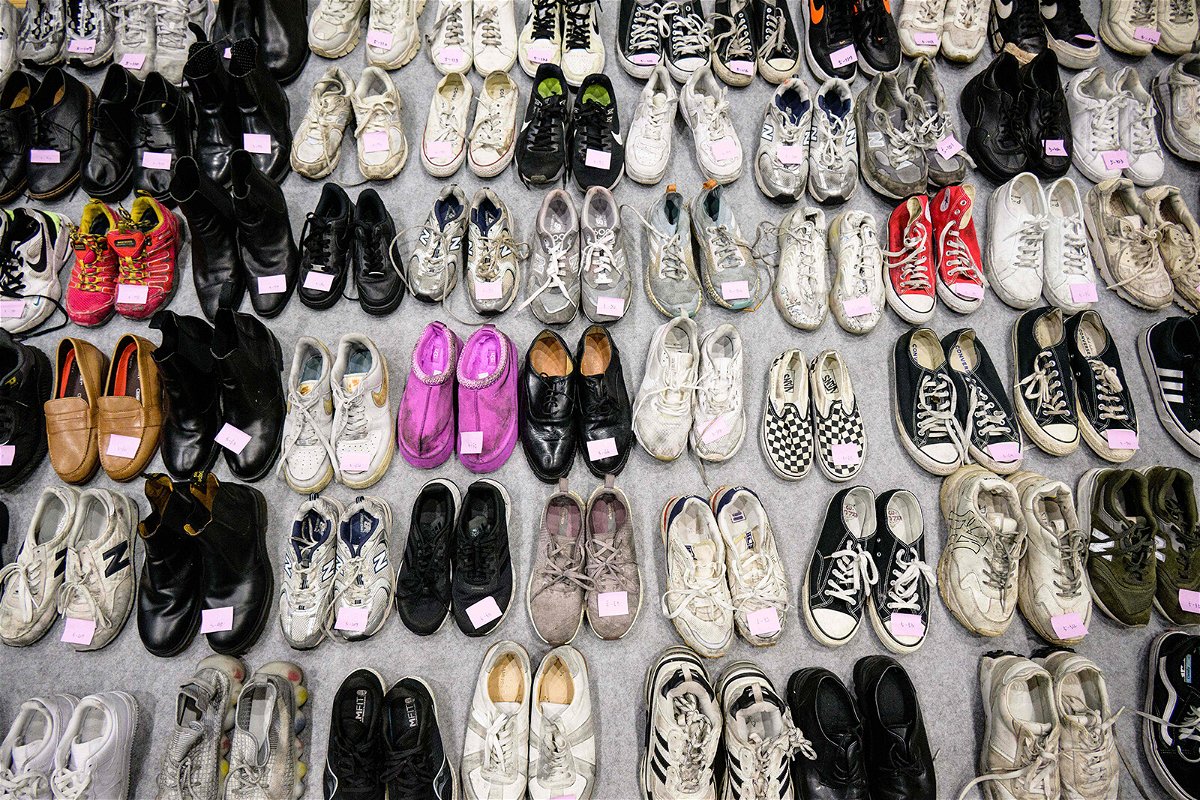 <i>Anthony Wallace/AFP/Getty Images</i><br/>A total of 256 pairs of shoes were lined up at the gymnasium -- 66 did not have a pair.