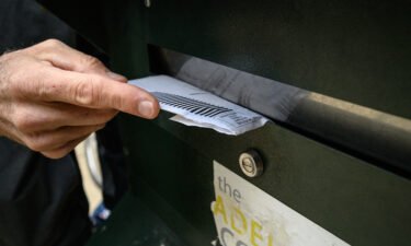 A voter casts their ballot at a drop box outside the Philadelphia city hall on October 24. The Pennsylvania Supreme Court has ordered that any general election ballots that are mailed in undated or incorrectly dated envelopes must be set aside and not counted.