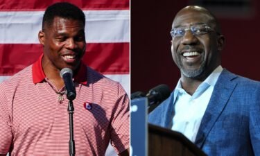 Republican candidate for US Senate Herschel Walker (L) and Senator Raphael Warnock are locked in a too-early-to-call Georgia Senate race.