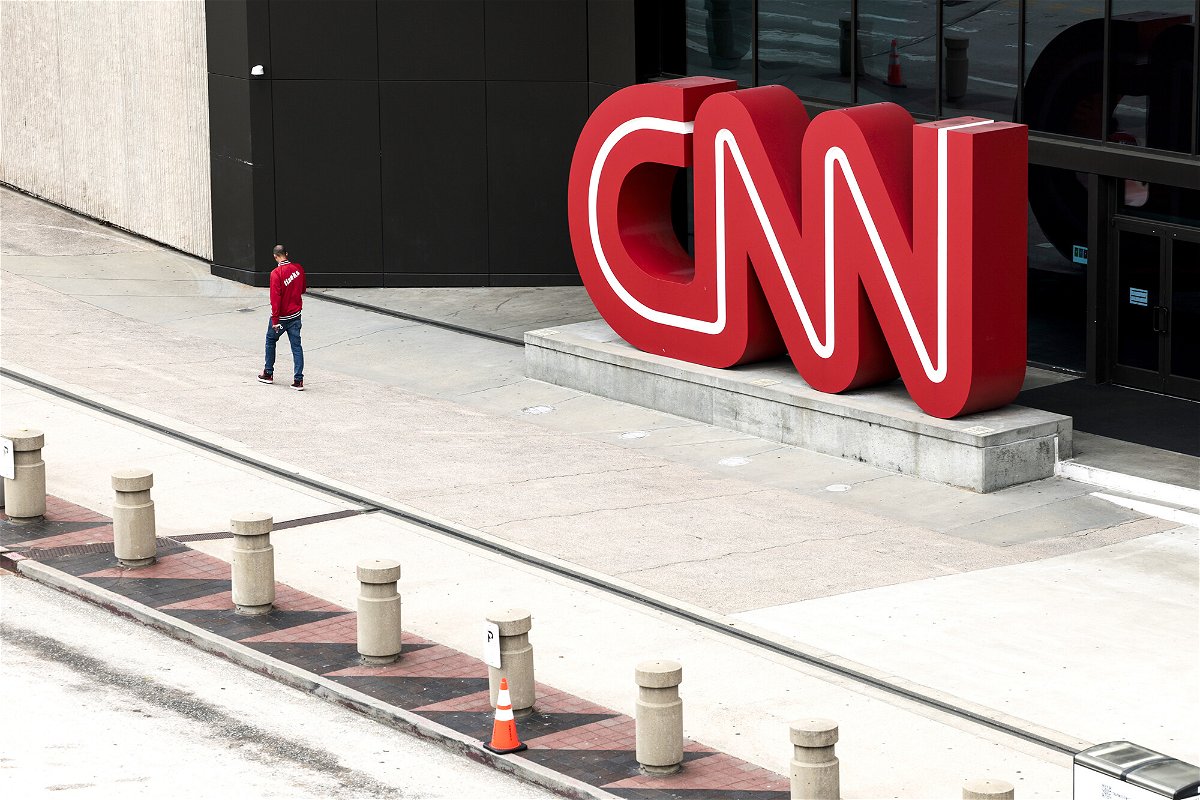 <i>Anna Moneymaker/Getty Images</i><br/>CNN begins layoffs in what CEO says will be a 'gut punch' to the network. People walk by the CNN headquarters on March 15
