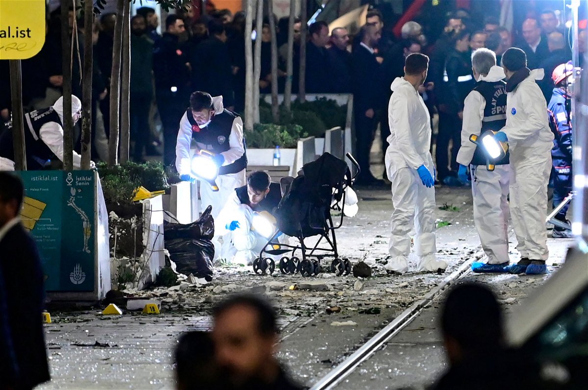 <i>Yasin Akgul/AFP/Getty Images</i><br/>Members of a forensic team work after a strong explosion shook the busy shopping street of Istiklal in Istanbul