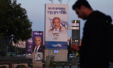 A picture shows an electoral banner for the Likud party depicting former prime minister Benjamin Netanyahu in Tel Aviv on October 27