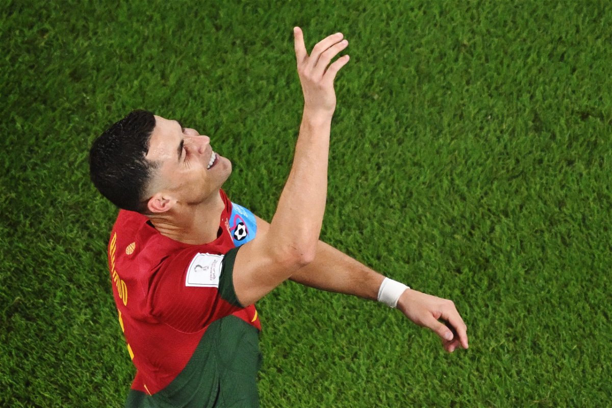 <i>KIRILL KUDRYAVTSEV/AFP/AFP via Getty Images</i><br/>Ronaldo celebrates scoring his history-making penalty against Ghana.
